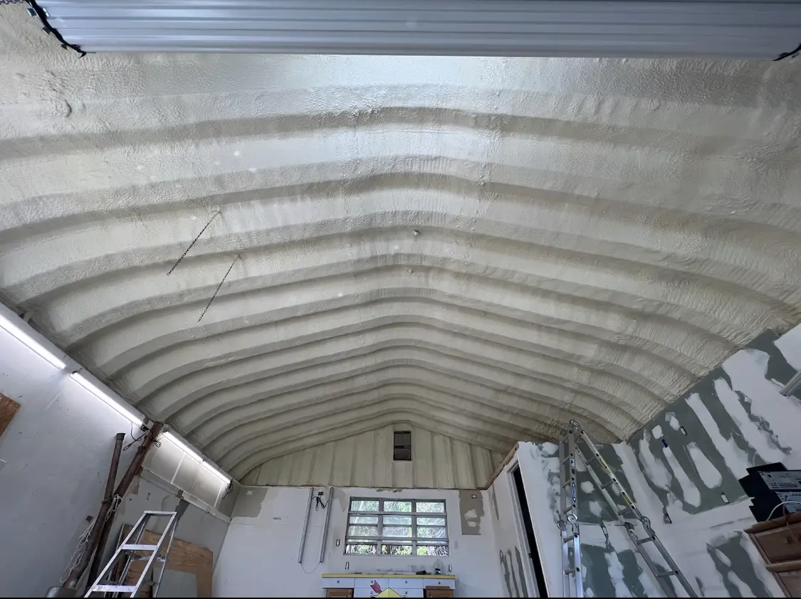 Spray polyurethane foam applied to the underside of a metal roof deck in Wilton